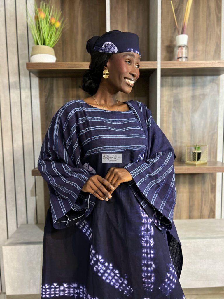 The Adire Muse indigo dress with striped detailing and matching headpiece by Ayish Qasim