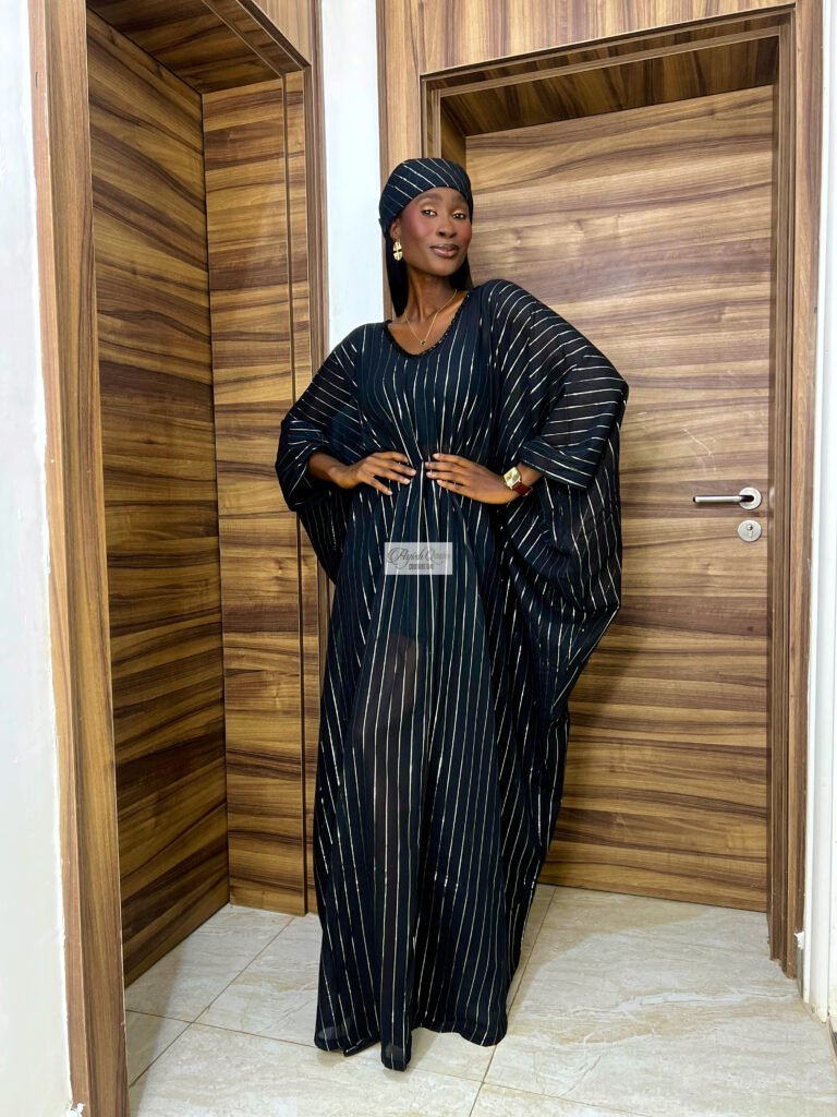 The Noir Stripe black dress with silver stripes and matching headwrap by Ayish Qasim