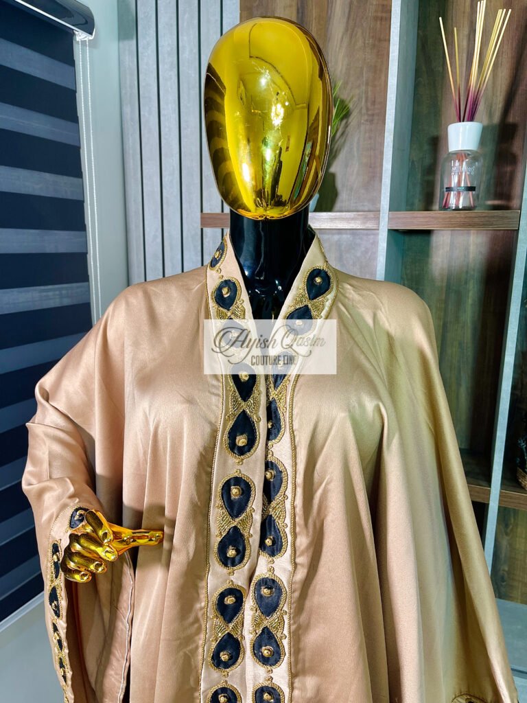 The Aurelia Kimono champagne gold African kimono with black and gold embroidered detailing by Ayish Qasim