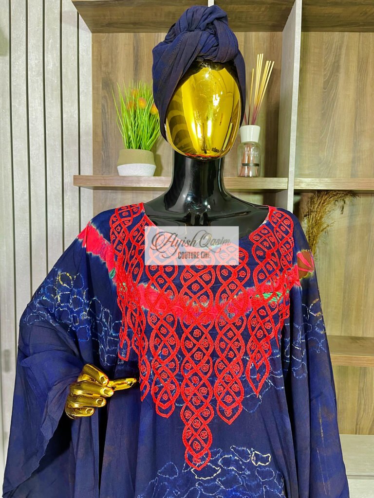 The Belladonna navy blue African dress with coral-pink embroidery, circular detailing, and matching headwrap by Ayish Qasim