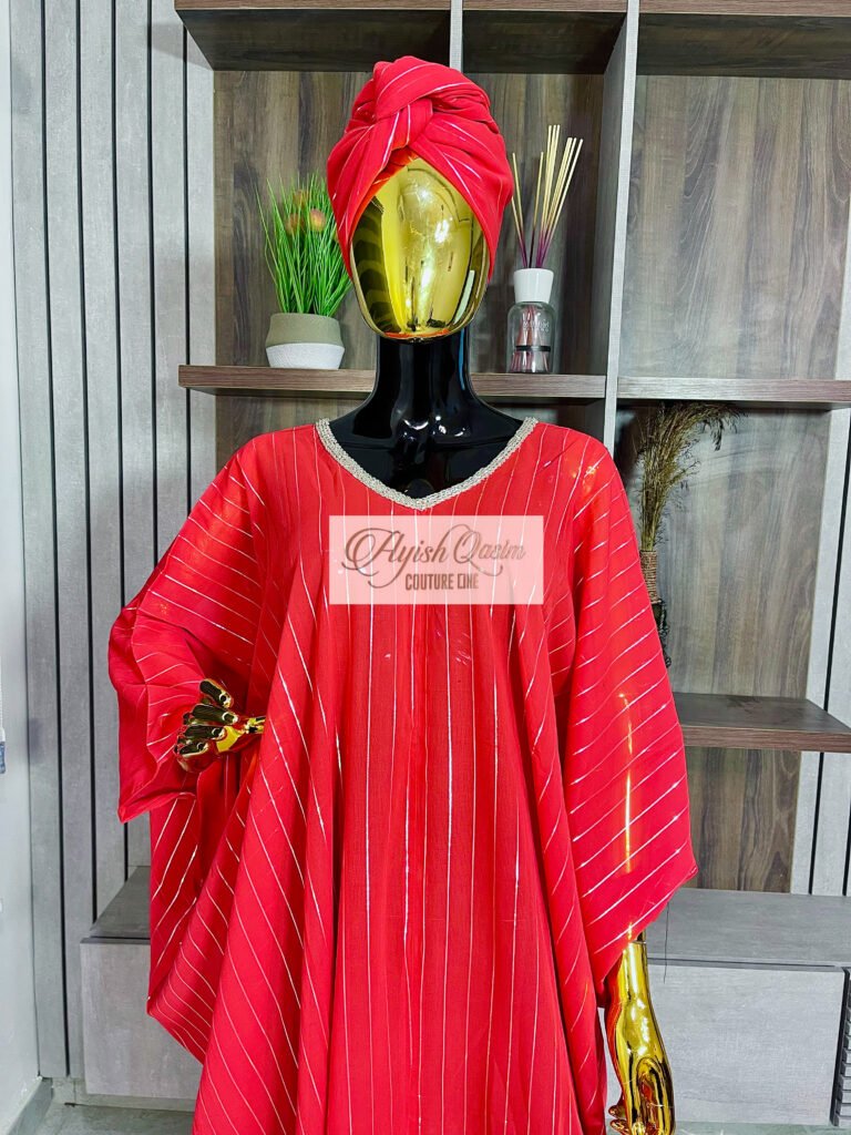 The Red Serenade red African dress with vertical detailing, flowing sleeves, and matching headwrap by Ayish Qasim