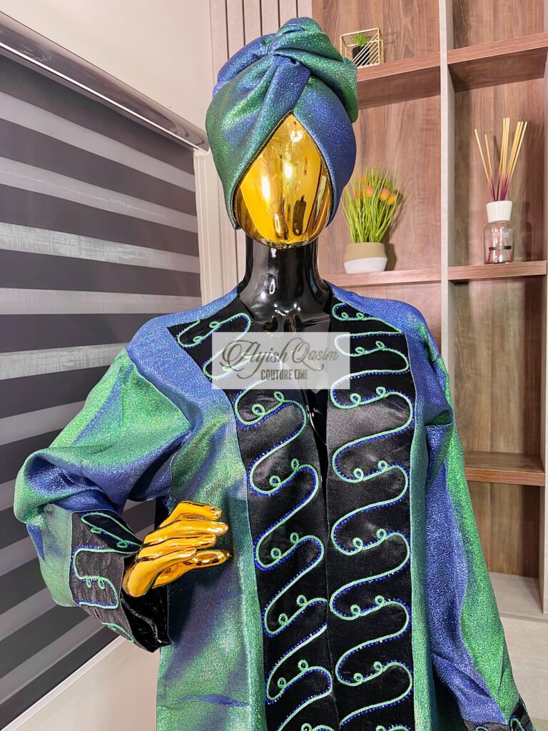 The Emerald Reverie green and blue shimmer dress with black embroidered detailing and matching headwrap by Ayish Qasim