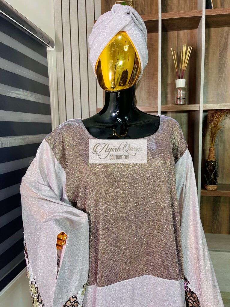 The Lumière champagne shimmer dress with white flowing sleeves and matching headwrap by Ayish Qasim