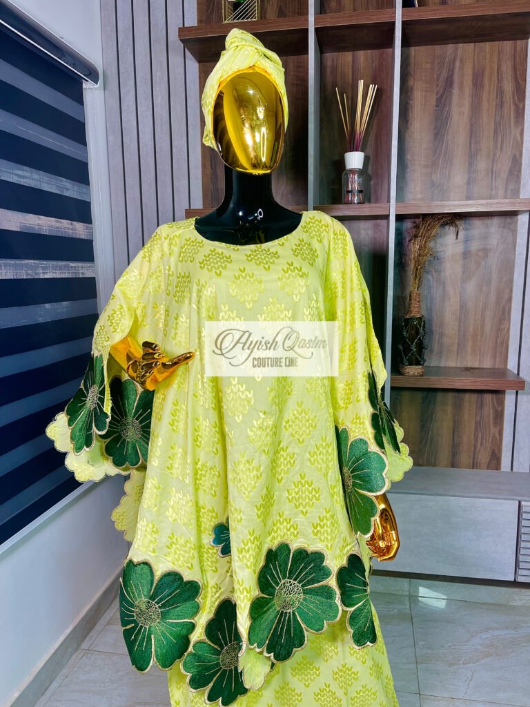 The Meadow Muse lime green dress with green and cream floral detailing and matching headwrap by Ayish Qasim