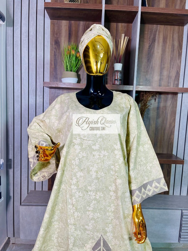 The Willow sage green and ivory dress with floral detailing, geometric hem and matching headwrap by Ayish Qasim